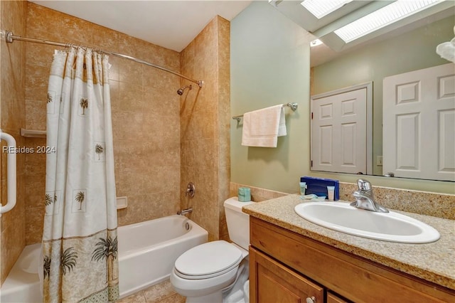 full bathroom with a skylight, tile patterned flooring, vanity, shower / tub combo, and toilet