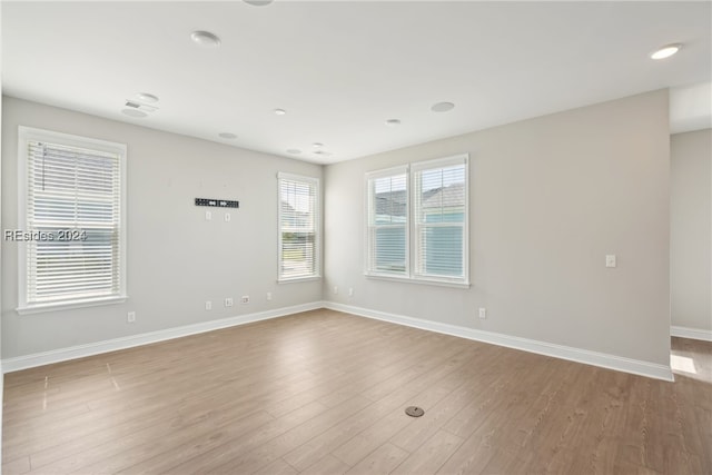 spare room featuring light hardwood / wood-style flooring