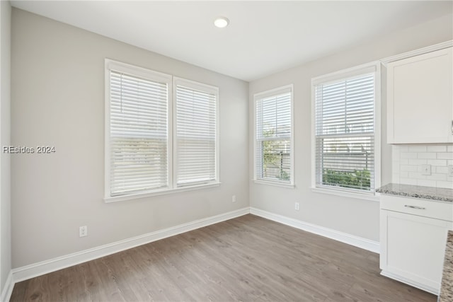 empty room with wood-type flooring