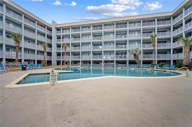 view of pool featuring a patio