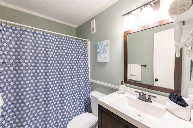 bathroom with vanity, ornamental molding, toilet, and a textured ceiling