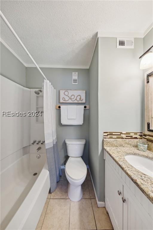 full bathroom with shower / bathtub combination with curtain, tile patterned flooring, vanity, a textured ceiling, and toilet