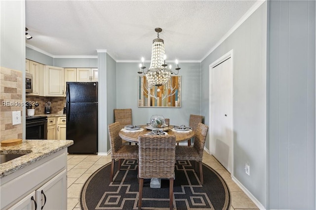 tiled dining area featuring ornamental molding, an inviting chandelier, and a textured ceiling