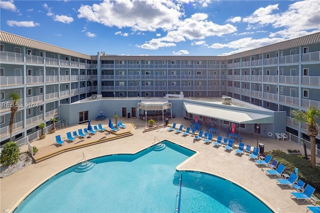 view of swimming pool featuring a patio