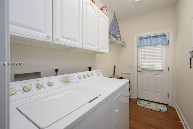 clothes washing area featuring cabinets and washing machine and clothes dryer