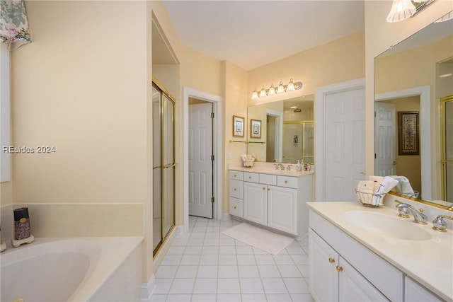 bathroom with tile patterned floors, independent shower and bath, and vanity