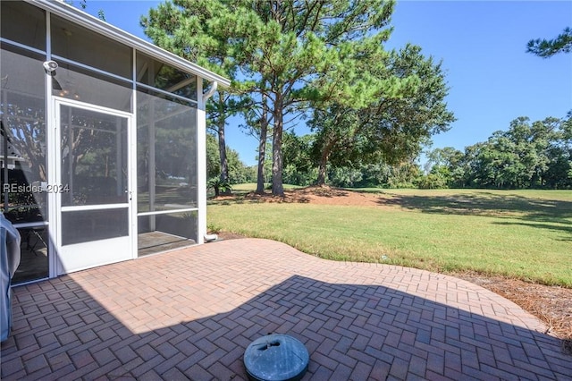 view of patio featuring a sunroom