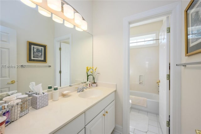 bathroom with tile patterned flooring, vanity, a washtub, and toilet