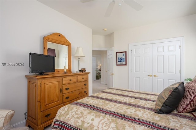 bedroom with ceiling fan and a closet