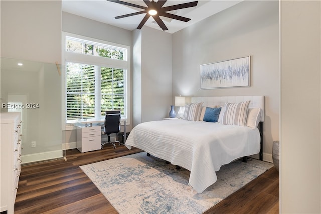 bedroom with dark wood-type flooring and ceiling fan