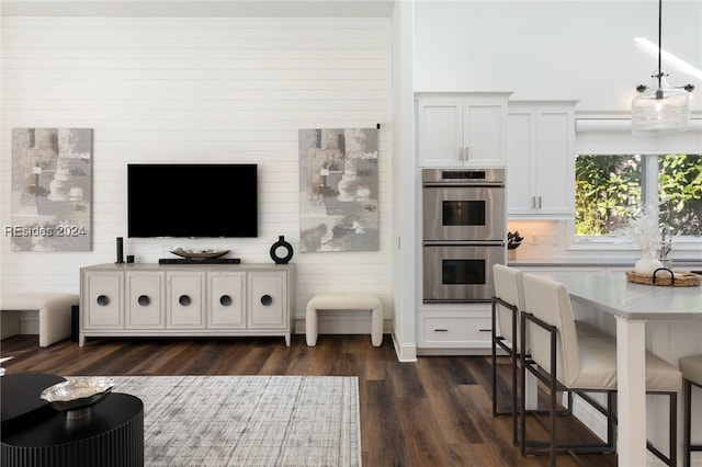 living room with dark hardwood / wood-style flooring