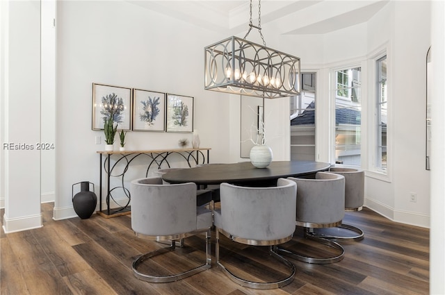 dining area featuring dark hardwood / wood-style flooring and a chandelier