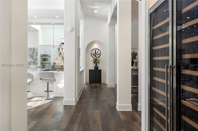 hall featuring wine cooler and dark hardwood / wood-style flooring