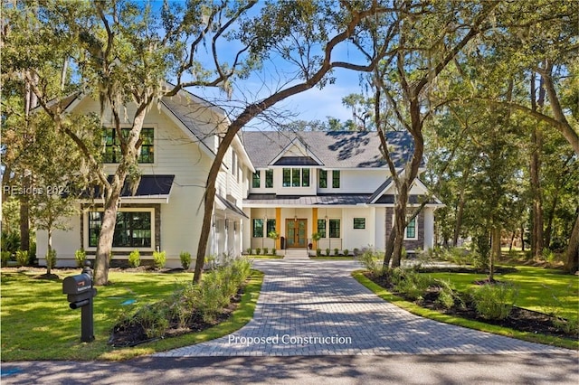 view of front of home with a porch and a front lawn