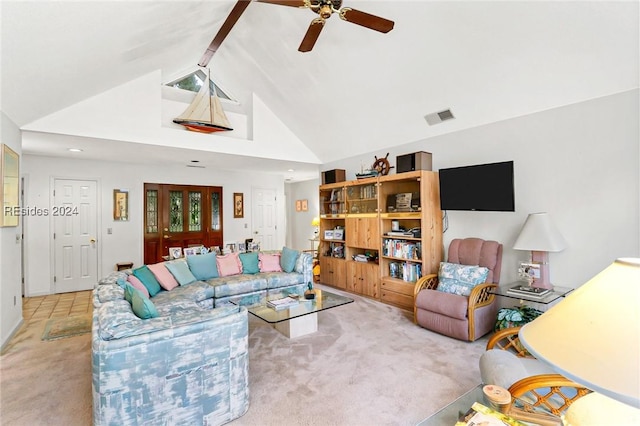 carpeted living room with vaulted ceiling and ceiling fan