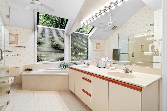 full bathroom with ceiling fan, tile patterned flooring, lofted ceiling with skylight, plus walk in shower, and toilet