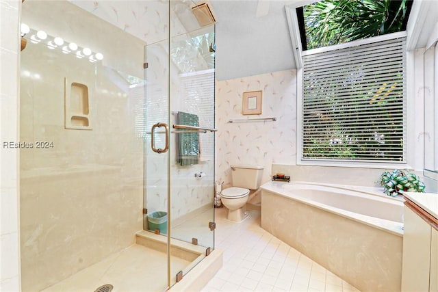 bathroom featuring tile patterned floors, toilet, and separate shower and tub