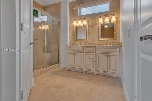 bathroom with vanity, tile patterned floors, and a shower with shower door