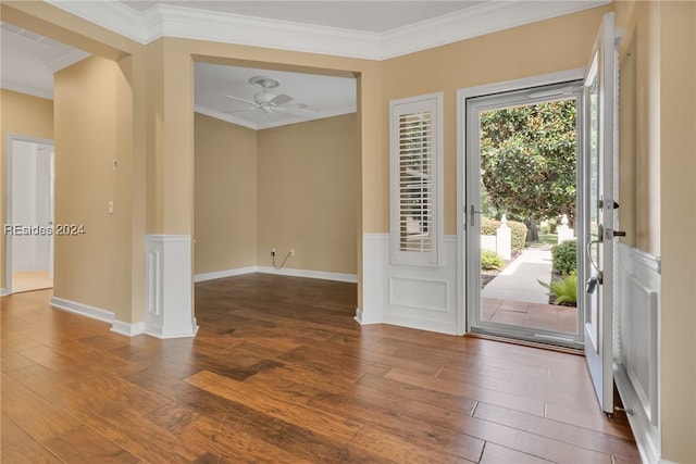 entrance foyer featuring wood-type flooring, ornamental molding, and ceiling fan