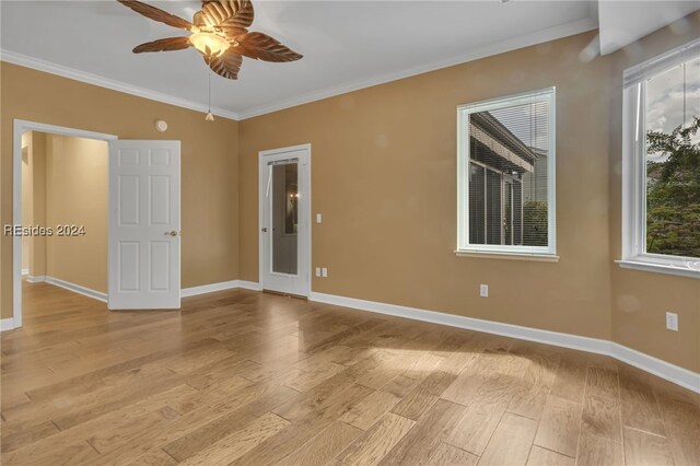 unfurnished room featuring light hardwood / wood-style flooring, ornamental molding, and ceiling fan