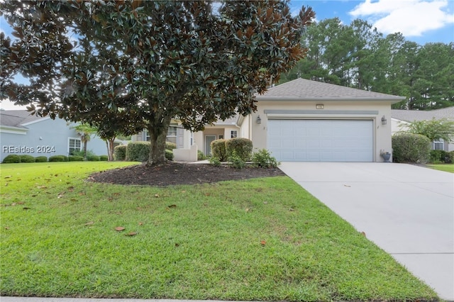 view of front of house featuring a garage and a front yard