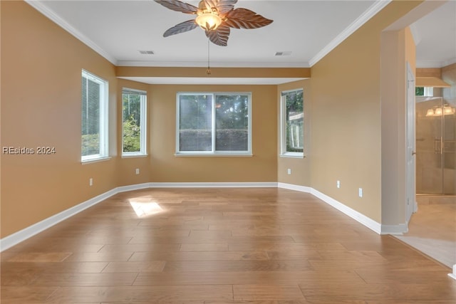 unfurnished room with ornamental molding, ceiling fan, and light hardwood / wood-style floors