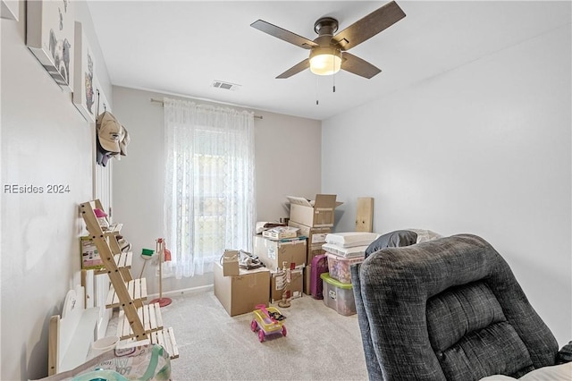 interior space with ceiling fan