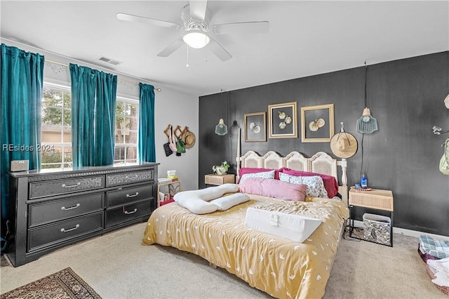 carpeted bedroom featuring ceiling fan