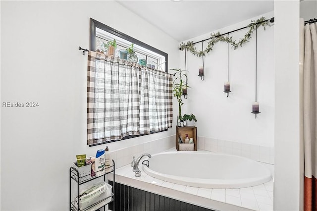 bathroom featuring tiled bath