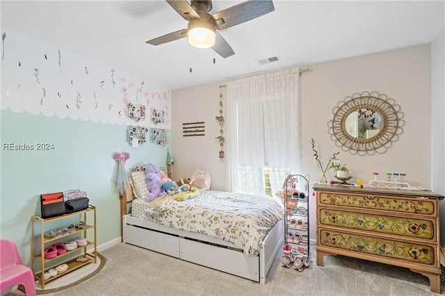 bedroom featuring light colored carpet and ceiling fan