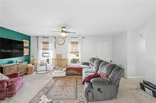 living room with light colored carpet and ceiling fan