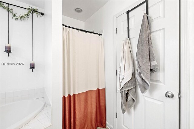 bathroom with tiled bath