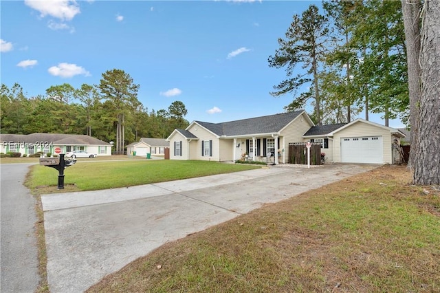 ranch-style home featuring a garage, a front yard, and covered porch