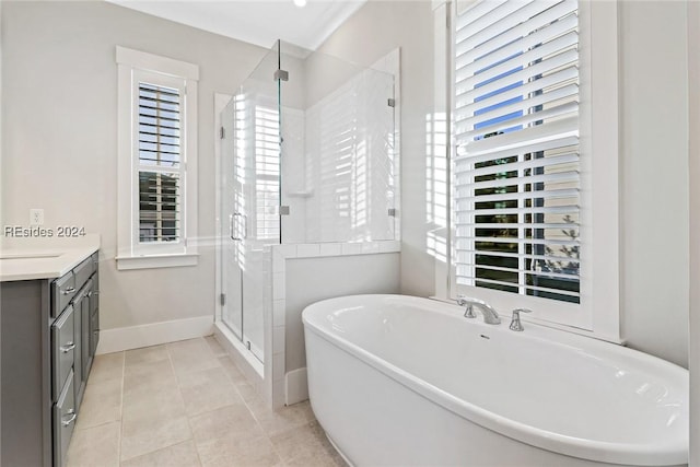 bathroom with tile patterned flooring, vanity, and independent shower and bath