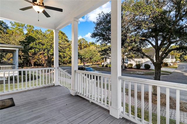 wooden deck with ceiling fan and a porch