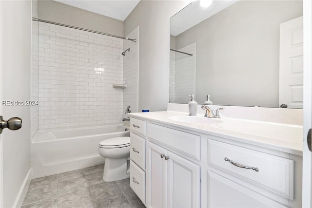 full bathroom featuring tiled shower / bath combo, vanity, tile patterned flooring, and toilet