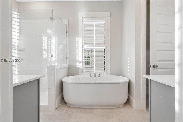 bathroom featuring vanity, tile patterned flooring, and independent shower and bath