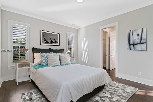 bedroom featuring dark wood-type flooring and crown molding