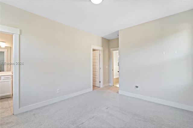 unfurnished bedroom featuring ensuite bath