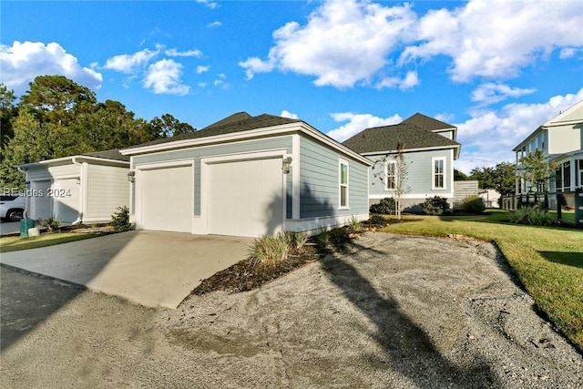 view of side of property featuring a garage