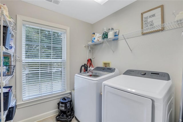 washroom featuring washing machine and dryer