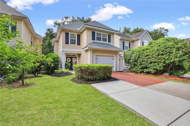 view of front of home featuring a garage and a front yard