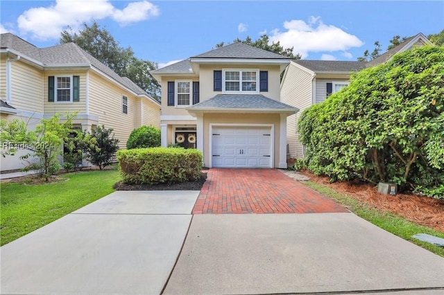 front facade with a garage and a front yard