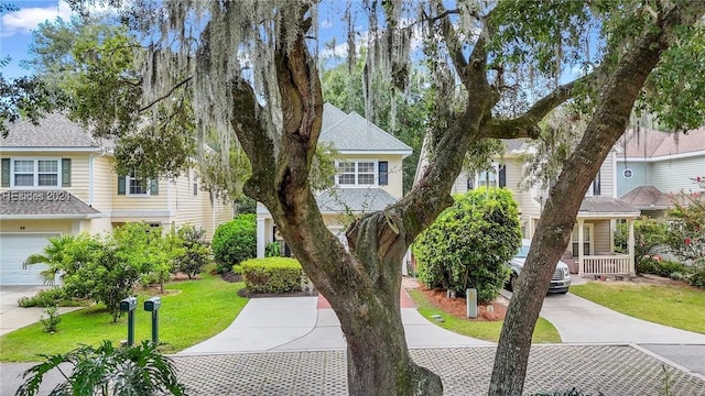 view of front of house featuring a garage and a front yard