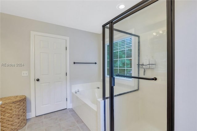 bathroom with tile patterned flooring and plus walk in shower