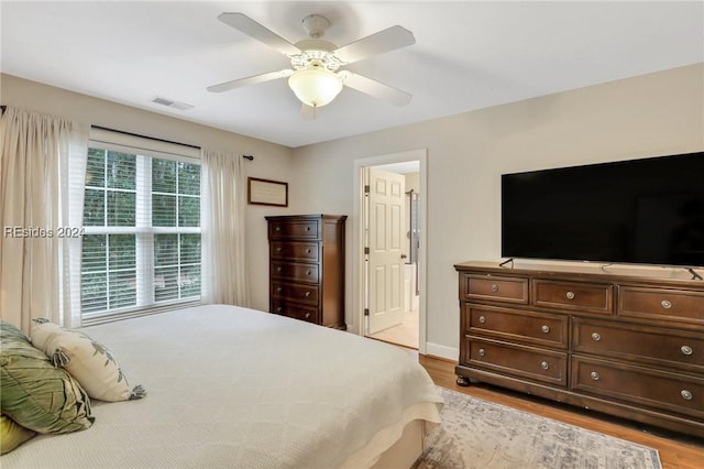 bedroom featuring ceiling fan and light hardwood / wood-style flooring