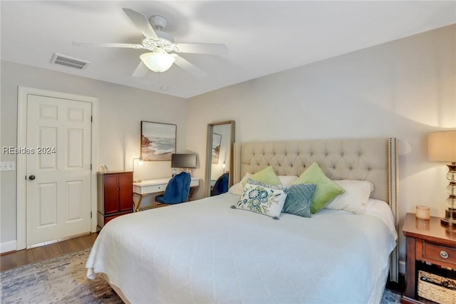 bedroom featuring hardwood / wood-style flooring and ceiling fan