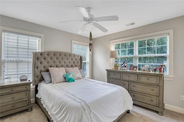 carpeted bedroom with ceiling fan