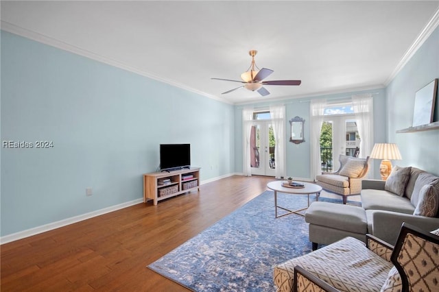 living room with crown molding, ceiling fan, wood-type flooring, and french doors