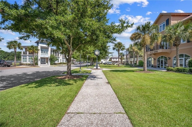 view of home's community featuring a lawn